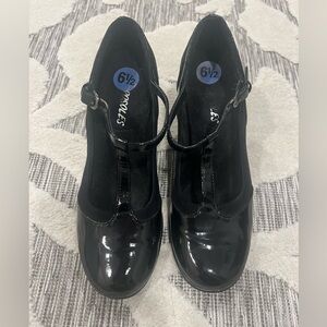 T-strapped patent leather. Worn twice. Great condition.